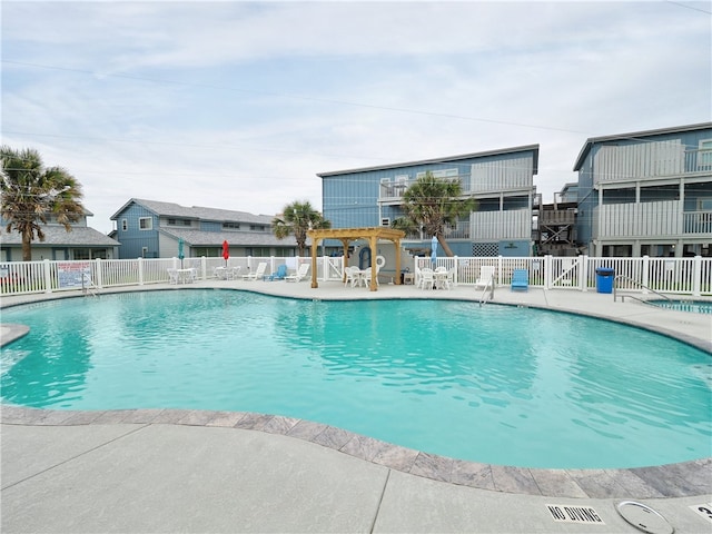 view of swimming pool with a patio area