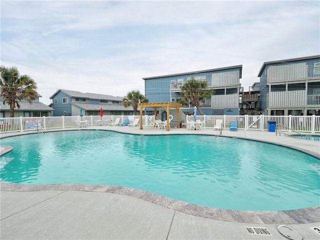 715 Beach Access Road 1a 1204, Port Aransas, TX 78373 - community pool featuring fence and a patio area