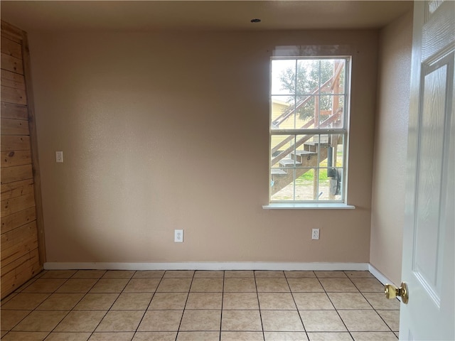 tiled empty room with wooden walls