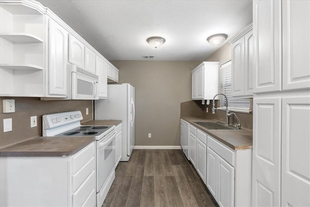 2718 Wind Rock Dr, Corpus Christi, TX 78410 - kitchen with white appliances, a sink, white cabinets, and dark wood-type flooring