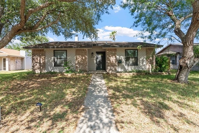 2718 Wind Rock Dr, Corpus Christi, TX 78410 - view of front of house with brick siding and a front lawn