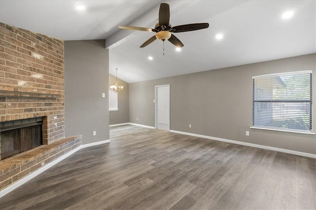 2718 Wind Rock Dr, Corpus Christi, TX 78410 - unfurnished living room with a chandelier, ceiling fan, a fireplace, wood finished floors, and baseboards