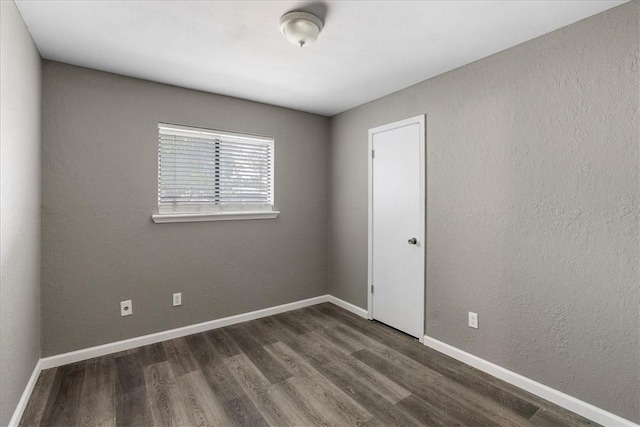 2718 Wind Rock Dr, Corpus Christi, TX 78410 - empty room with dark wood-type flooring and baseboards