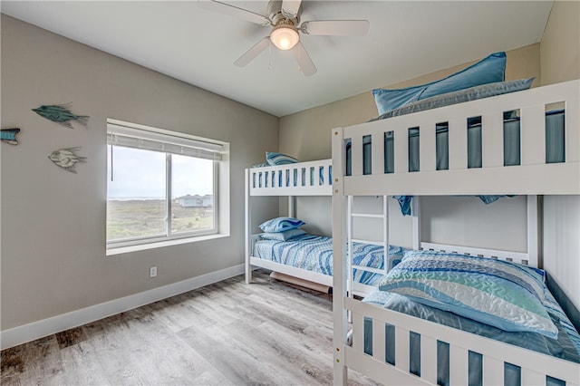 bedroom with hardwood / wood-style floors and ceiling fan