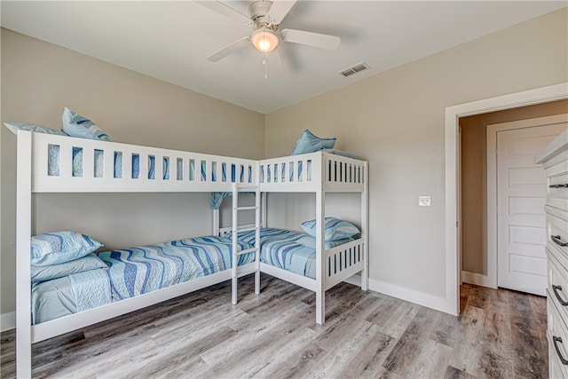 bedroom featuring light wood-type flooring and ceiling fan