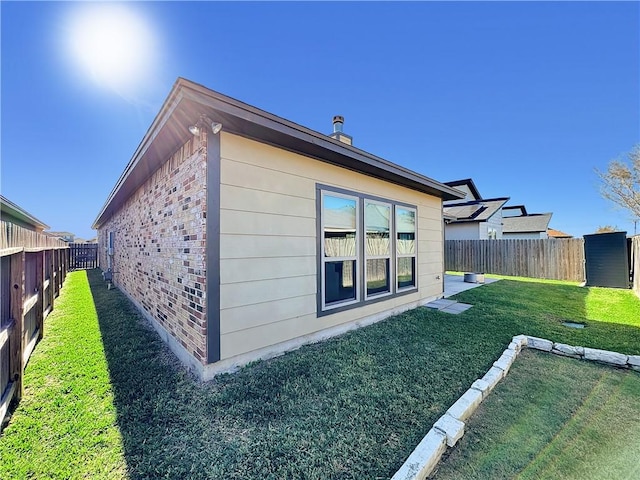 view of home's exterior featuring a yard