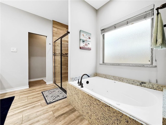 bathroom with shower with separate bathtub