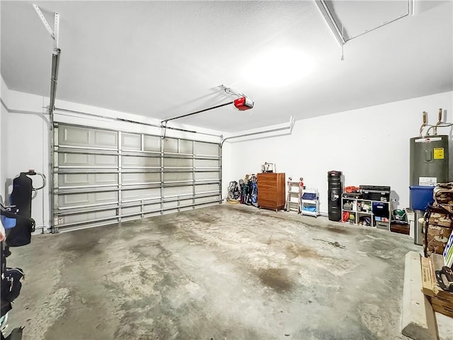 garage featuring electric water heater and a garage door opener