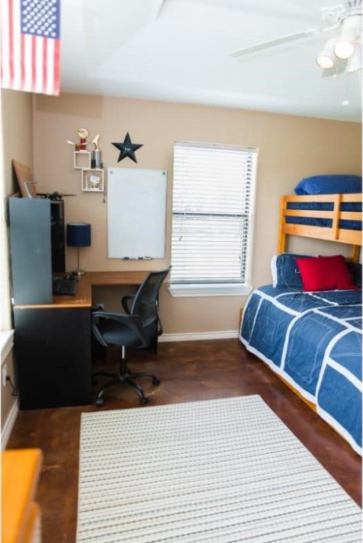 bedroom featuring dark wood-type flooring and ceiling fan