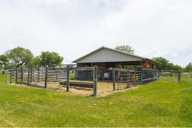 view of stable with a rural view