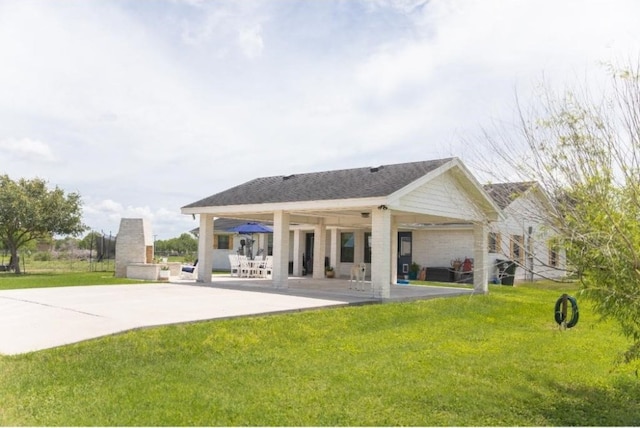 back of house featuring a patio, a yard, and ceiling fan