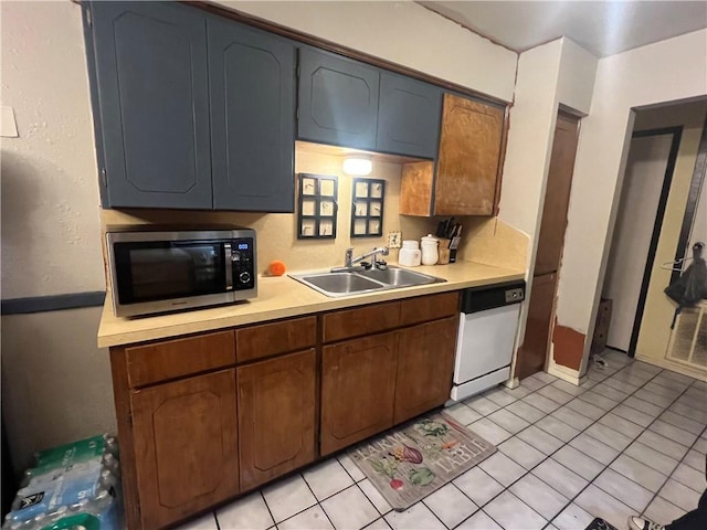 11506 Turkey Creek Dr, Corpus Christi, TX 78410 - kitchen featuring stainless steel microwave, white dishwasher, light countertops, and light tile patterned floors