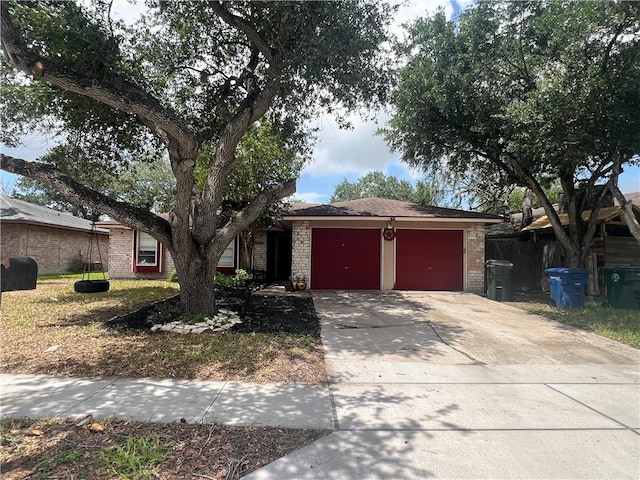 11506 Turkey Creek Dr, Corpus Christi, TX 78410 - view of front facade featuring a garage, brick siding, and concrete driveway