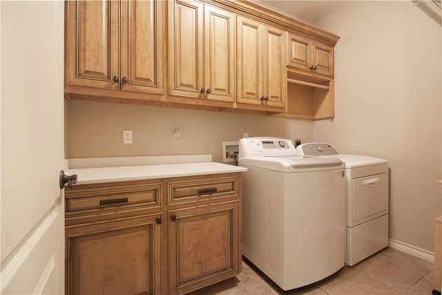 6825 Old Square Dr, Corpus Christi, TX 78414 - washroom featuring cabinet space, washer and dryer, and light tile patterned floors