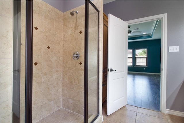 6825 Old Square Dr, Corpus Christi, TX 78414 - full bathroom featuring a shower stall, a raised ceiling, tile patterned flooring, and a ceiling fan