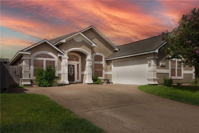 6825 Old Square Dr, Corpus Christi, TX 78414 - view of front facade featuring stucco siding, driveway, an attached garage, and roof with shingles