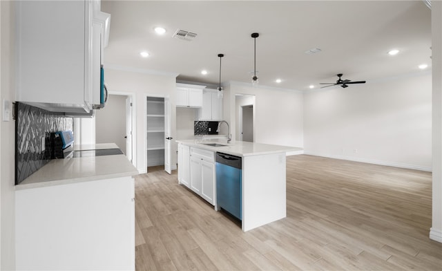 kitchen featuring an island with sink, dishwasher, white cabinets, and decorative light fixtures