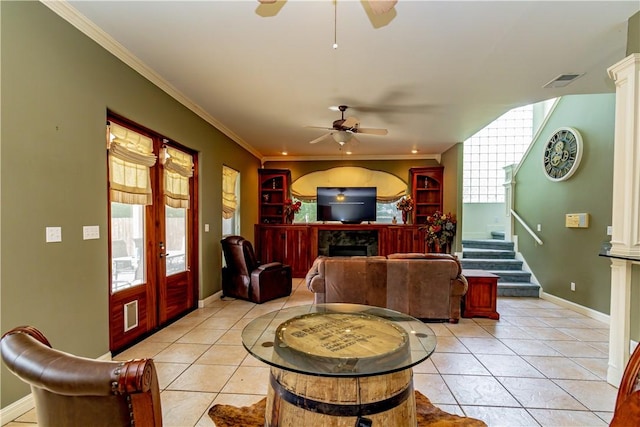 7906 Valtourmanche Dr, Corpus Christi, TX 78414 - living area with a ceiling fan, a fireplace, light tile patterned floors, stairs, and ornamental molding