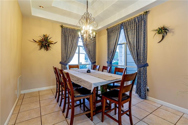7906 Valtourmanche Dr, Corpus Christi, TX 78414 - dining space featuring a chandelier, light tile patterned floors, a raised ceiling, and baseboards