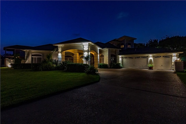 7906 Valtourmanche Dr, Corpus Christi, TX 78414 - mediterranean / spanish-style house featuring an attached garage, driveway, and a yard