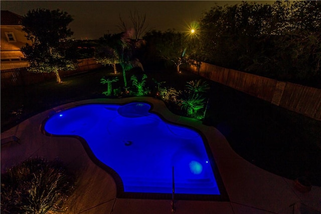 7906 Valtourmanche Dr, Corpus Christi, TX 78414 - pool at twilight featuring a fenced backyard
