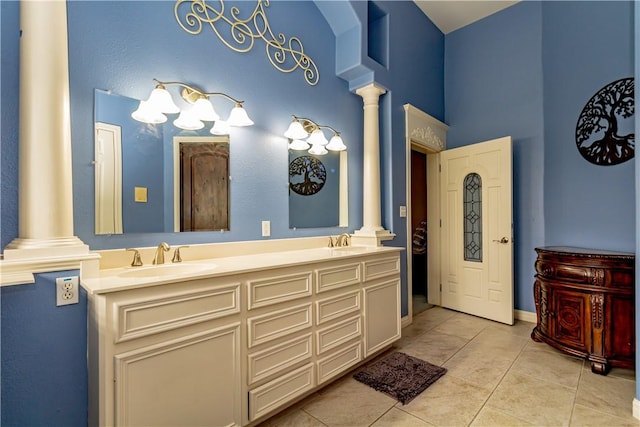 7906 Valtourmanche Dr, Corpus Christi, TX 78414 - full bath featuring decorative columns, a high ceiling, tile patterned floors, and double vanity