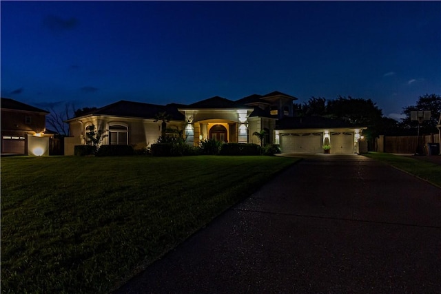 7906 Valtourmanche Dr, Corpus Christi, TX 78414 - mediterranean / spanish-style home featuring driveway, a lawn, and a garage