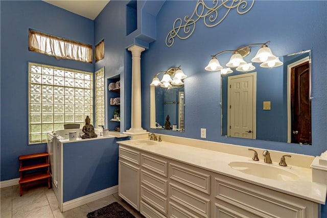 7906 Valtourmanche Dr, Corpus Christi, TX 78414 - full bathroom with decorative columns, plenty of natural light, and double vanity