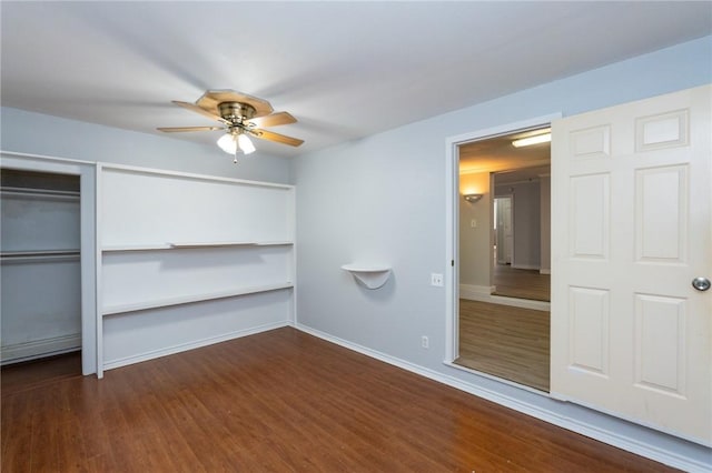 unfurnished bedroom featuring ceiling fan and dark hardwood / wood-style floors