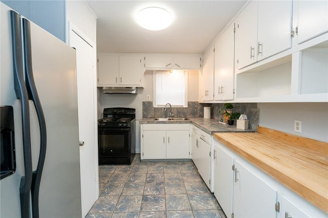 kitchen with white cabinets, stainless steel fridge, sink, and black gas stove