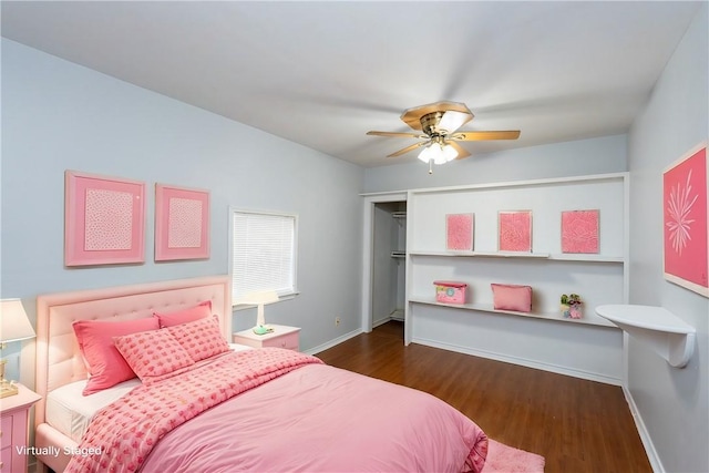 bedroom with ceiling fan and dark hardwood / wood-style floors