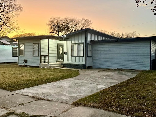 ranch-style house featuring a lawn