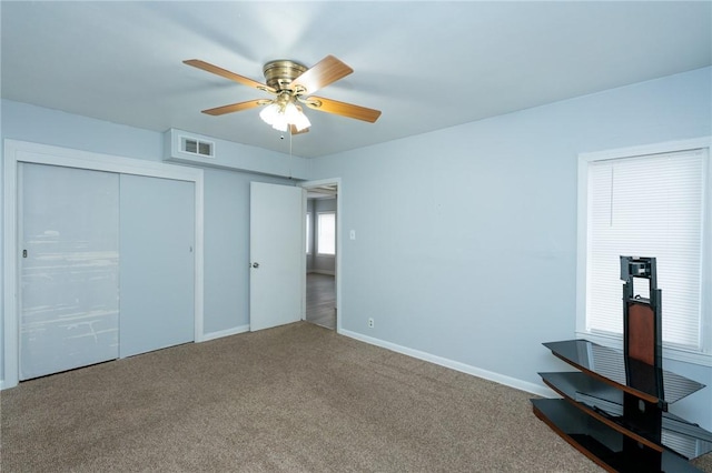 unfurnished bedroom with carpet and ceiling fan