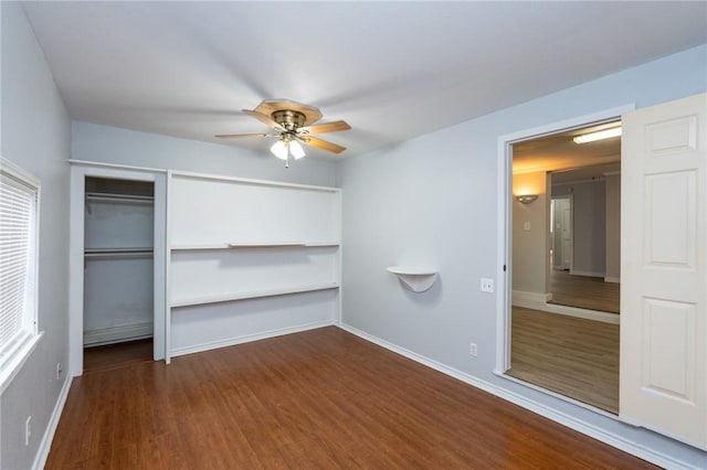 unfurnished bedroom with ceiling fan, a closet, and dark hardwood / wood-style floors