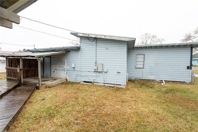 rear view of house with a lawn