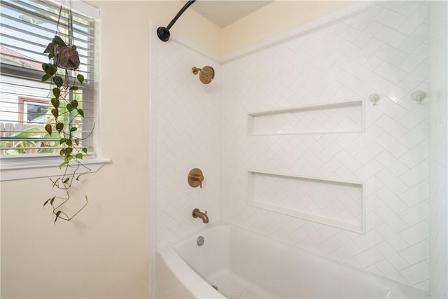 full bathroom featuring a wealth of natural light and bathtub / shower combination