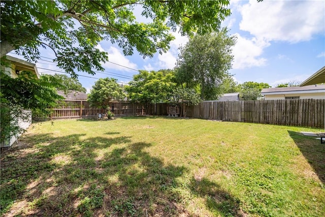 view of yard featuring a fenced backyard