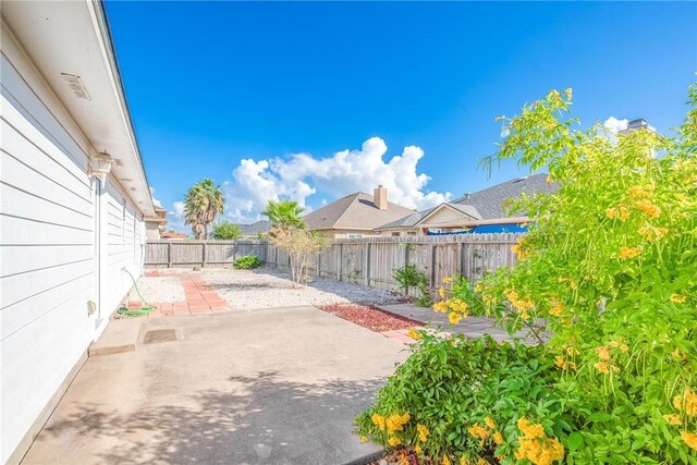 15522 Finistere St, Corpus Christi, TX 78418 - fenced backyard with a patio