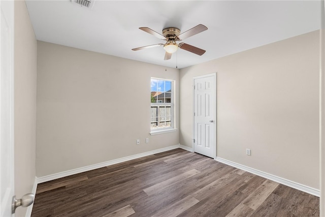 unfurnished room with hardwood / wood-style flooring and ceiling fan