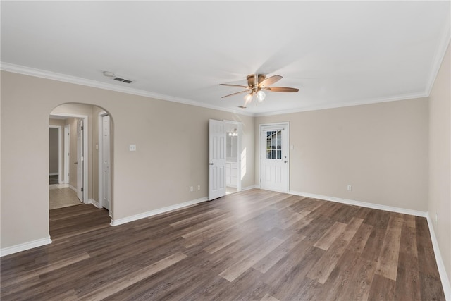 spare room with dark wood-type flooring, ceiling fan, and ornamental molding