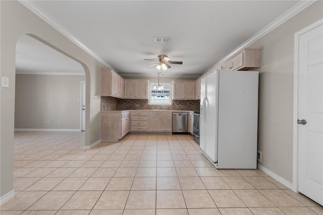 15522 Finistere St, Corpus Christi, TX 78418 - kitchen featuring white refrigerator with ice dispenser, stainless steel dishwasher, light brown cabinets, ceiling fan, and arched walkways
