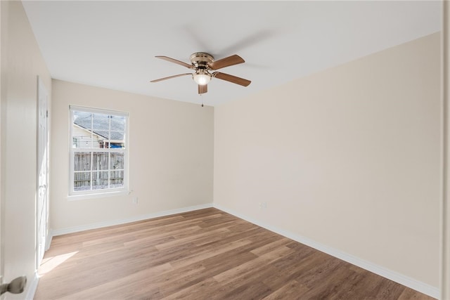 empty room featuring light hardwood / wood-style flooring and ceiling fan