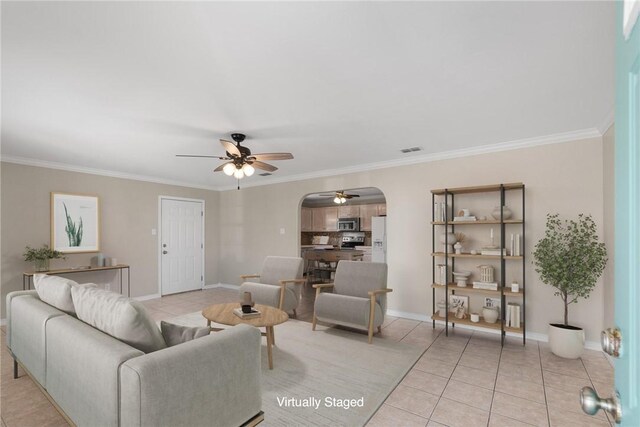 15522 Finistere St, Corpus Christi, TX 78418 - living area featuring arched walkways, a ceiling fan, light tile patterned flooring, and ornamental molding