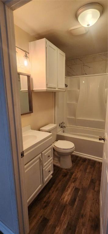 103 Lee Ave, Gregory, TX 78359 - full bathroom with vanity, wood finished floors, bathtub / shower combination, and toilet