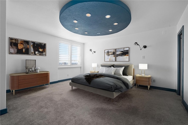 carpeted bedroom featuring a textured ceiling