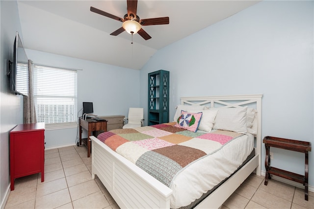 bedroom with ceiling fan, light tile patterned floors, and lofted ceiling