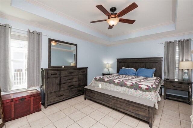 tiled bedroom with crown molding, ceiling fan, and a raised ceiling