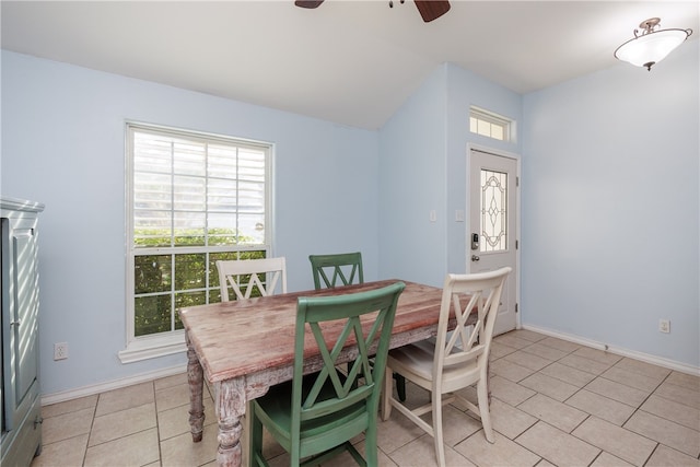 tiled dining area featuring ceiling fan