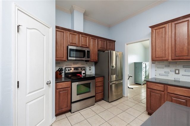 kitchen with ornamental molding, appliances with stainless steel finishes, light tile patterned flooring, and tasteful backsplash