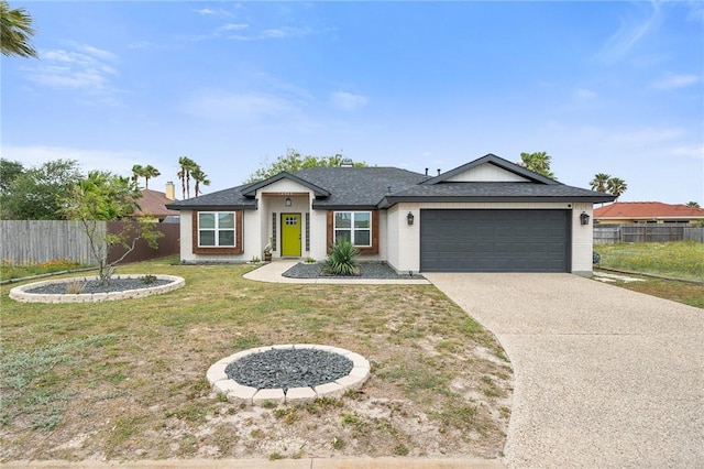 ranch-style house with concrete driveway, fence, a front lawn, and a garage